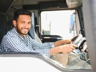 young-indian-truck-driver-concept-of-road-freight-2023-11-27-05-00-23-utc