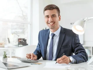 depositphotos_331453854-stock-photo-male-bank-manager-working-in