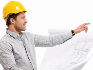 a-man-in-a-hard-hat-pointing-at-a-blueprint-free-photo