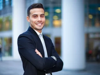 depositphotos_146586449-stock-photo-businessman-smiling-in-urban-setting