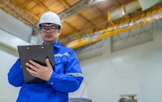 chief-engineer-works-large-industrial-plantmy-supervisor-inspects-operation-machines-machine-shop_44277-29886