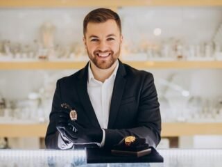 handsome-sales-man-demonstrating-watches-jewelry-shop_1303-30680