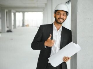 indian-construction-site-manager-standing-wearing-helmet-thinking-at-construction-site-portrait-of-mixed-race-manual-worker-or-architect-photo