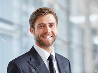 51813450-portrait-of-a-stylish-corporate-executive-smiling-confidently-at-the-camera