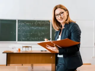 depositphotos_229020394-stock-photo-beautiful-female-teacher-formal-wear